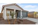 Front exterior of a single-story home with landscaping and a two-car garage at 3787 S 233Rd Ln, Buckeye, AZ 85326