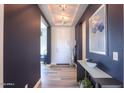 Modern entryway with dark blue walls and a view of interior at 4414 W Jacaranda Dr, Eloy, AZ 85131