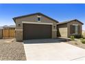 Two-car garage and side view of a new construction home at 5532 N 192Nd Ln, Litchfield Park, AZ 85340