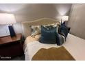 Cozy bedroom with plush bedding and nightstands at 6125 E Indian School Rd # 164, Scottsdale, AZ 85251