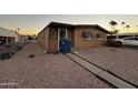 Front view of a tan manufactured home with a walkway at 6723 W Fillmore St # 301, Phoenix, AZ 85043