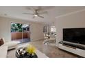 Living room features sliding glass doors to patio, creating an open and airy feel at 8260 E Arabian Trl # 151, Scottsdale, AZ 85258