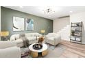 Bright living room features stylish furniture and a modern coffee table at 1136 N 84Th Pl, Scottsdale, AZ 85257