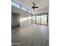 Bright living room with hardwood floors and sliding glass doors at 16041 N 31St St # 16, Phoenix, AZ 85032