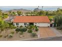 Single-story home with tile roof, desert landscaping, and mountain views at 16804 E Monterey Dr, Fountain Hills, AZ 85268