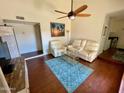 Bright living room with hardwood floors, comfy seating, and a ceiling fan at 1831 E Kirkland Ln # B, Tempe, AZ 85281