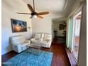 Bright living room with hardwood floors, comfy seating, and a ceiling fan at 1831 E Kirkland Ln # B, Tempe, AZ 85281