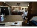 View of a kitchen with stainless steel appliances and granite countertops at 350 N 88Th St, Mesa, AZ 85207