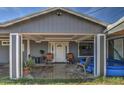 Covered porch with rocking chairs and potted plants at 4617 S 8Th St, Phoenix, AZ 85040