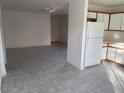 Open concept kitchen and living area with tiled floors at 4723 N 84Th Ln, Phoenix, AZ 85037