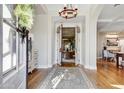 Bright and airy entryway with hardwood floors and a view to the living area at 10191 E Diamond Rim Dr # 2122, Scottsdale, AZ 85255