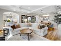 Open living space with hardwood floors, large windows, and comfortable seating at 10191 E Diamond Rim Dr # 2122, Scottsdale, AZ 85255