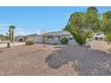 House exterior showcasing a manicured yard and a charming facade at 11029 W Cherry Hills Dr, Sun City, AZ 85351