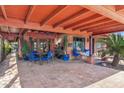 Covered patio with brick flooring and seating area at 1310 W Marshall Ave, Phoenix, AZ 85013