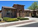 Spanish style home with a two-car garage and desert landscaping at 2816 W Pollack St, Phoenix, AZ 85041