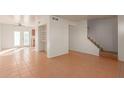Living room with tile floors, and staircase at 3605 W Bethany Home Rd # 21, Phoenix, AZ 85019