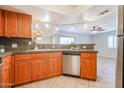 Modern kitchen with granite countertops and stainless steel dishwasher at 5104 N 32Nd St # 129, Phoenix, AZ 85018