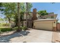 House exterior with a large driveway and mature trees at 5524 N 3Rd Ave, Phoenix, AZ 85013