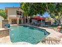 Inviting backyard oasis featuring a sparkling pool, patio furniture, and lush greenery at 5524 N 3Rd Ave, Phoenix, AZ 85013