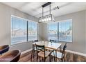 Bright dining area with a wooden table and modern light fixture at 9433 W Cinnabar Ave, Peoria, AZ 85345