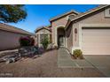 One-story house with a pink garage door and walkway to the entrance at 12742 W Ash St, El Mirage, AZ 85335