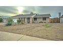 Front view of a brick ranch house with drought-tolerant landscaping at 17628 N 39Th Ave, Glendale, AZ 85308