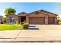 Beautiful Ranch style home with 3 car garage and well-manicured lawn at 25642 N Fernbush Dr, Phoenix, AZ 85083