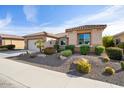 Single-story home with a two-car garage and desert landscaping at 26553 W Vista North Dr, Buckeye, AZ 85396