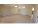 Spacious living room with tile floors and a ceiling fan at 4901 W Cheery Lynn Rd, Phoenix, AZ 85031