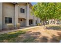 Neatly landscaped walkway to condo building entrance at 6262 E Brown Rd # 27, Mesa, AZ 85205