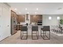 Modern kitchen with stainless steel appliances and an island at 18322 W Long Lake Rd, Goodyear, AZ 85338