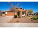 House exterior featuring a landscaped front yard and brick driveway at 18362 W Illini St, Goodyear, AZ 85338