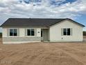 Newly constructed home featuring a neutral exterior and stone accents at 18945 W Mead Dr, Buckeye, AZ 85326