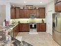 Modern kitchen featuring granite countertops and ample cabinetry at 3575 N Colonial Ct, Florence, AZ 85132