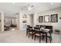 Bright dining room features a table with six chairs and access to the living room at 4842 E Charleston Ave, Scottsdale, AZ 85254