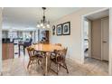 Bright dining area with a round table and four chairs at 12420 W Wildwood Dr, Sun City West, AZ 85375