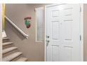 Staircase and front door entry at 42424 N Gavilan Peak Pkwy # 42206, Anthem, AZ 85086