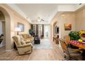 Spacious living room with hardwood floors and a cozy seating area at 14575 W Mountain View Blvd # 11309, Surprise, AZ 85374