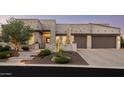 Modern home exterior with stone accents and landscaped yard at 17504 E Brushy Mountain Ct, Rio Verde, AZ 85263