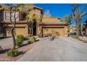Tan two-story home with attached garage and landscaped front yard at 21320 N 56Th St # 2175, Phoenix, AZ 85054