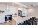 Modern kitchen features stainless steel appliances and white cabinetry at 3131 N Central Ave # 6022, Phoenix, AZ 85012