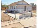 White house with a front porch and gated entrance at 393 N 20Th Dr, Phoenix, AZ 85009