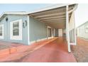 Mobile home side view showcasing covered patio at 5735 E Mcdowell Rd # 457, Mesa, AZ 85215