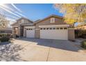 Two-story home with a three-car garage and neutral color scheme at 27204 N 86Th Dr, Peoria, AZ 85383