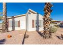 Single story home with carport and desert landscaping at 3301 S Goldfield Rd # 1004, Apache Junction, AZ 85119