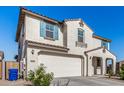 Two-story house with light-colored exterior, a two-car garage, and landscaping at 10254 W Piccadilly Rd, Avondale, AZ 85392