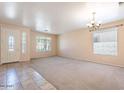 Bright living room with tile floors and neutral decor at 10419 E Kiva Ave, Mesa, AZ 85209
