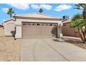 Front exterior of a single-story home with a two-car garage and desert landscaping at 4714 E Charleston Ave, Phoenix, AZ 85032