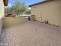 Private paved patio with brickwork and access to the home at 3576 N Carlton St, Buckeye, AZ 85396