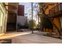 Landscaped courtyard with modern building in background at 4745 N Scottsdale Rd # 3013, Scottsdale, AZ 85251